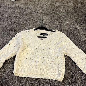 Long sleeve cream sweater. Worn once. Tags still on. Thick sweater material.